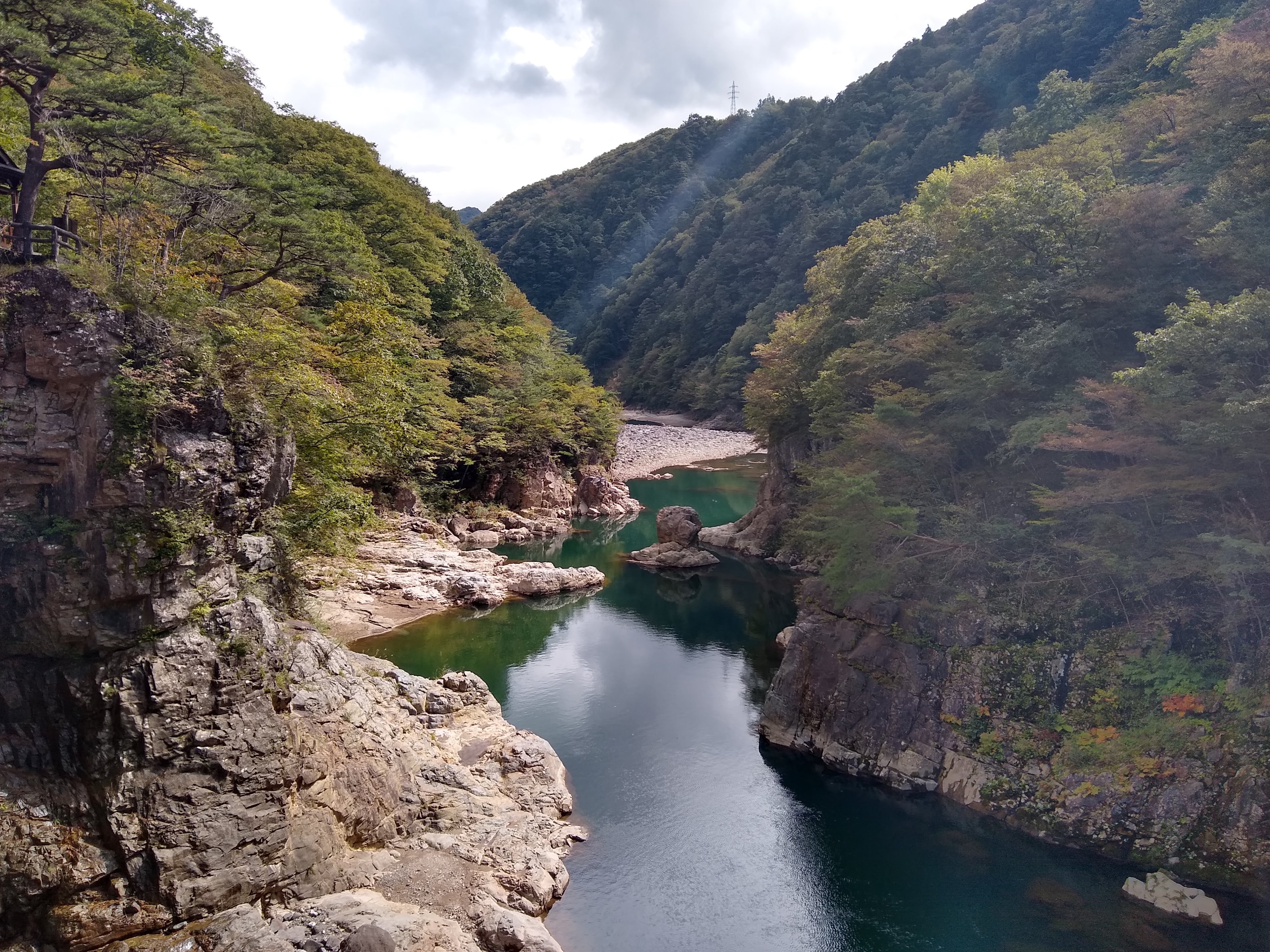 Ryūōkyō gorge in Kinugawa — turquoise river winding between forested cliffs, photographed by Rex in October 2019.